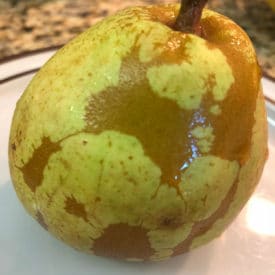 You can eat a pear with a brown webbed pattern like this
