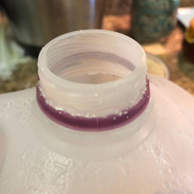 crust on the top of milk jug isn't a safety issue