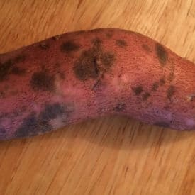 Sweet potatoes with spots that are still edible if peeled