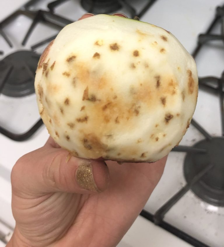 Sunken black spots on an apple
