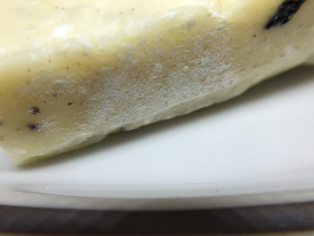 Close up of white mold filaments on cheese