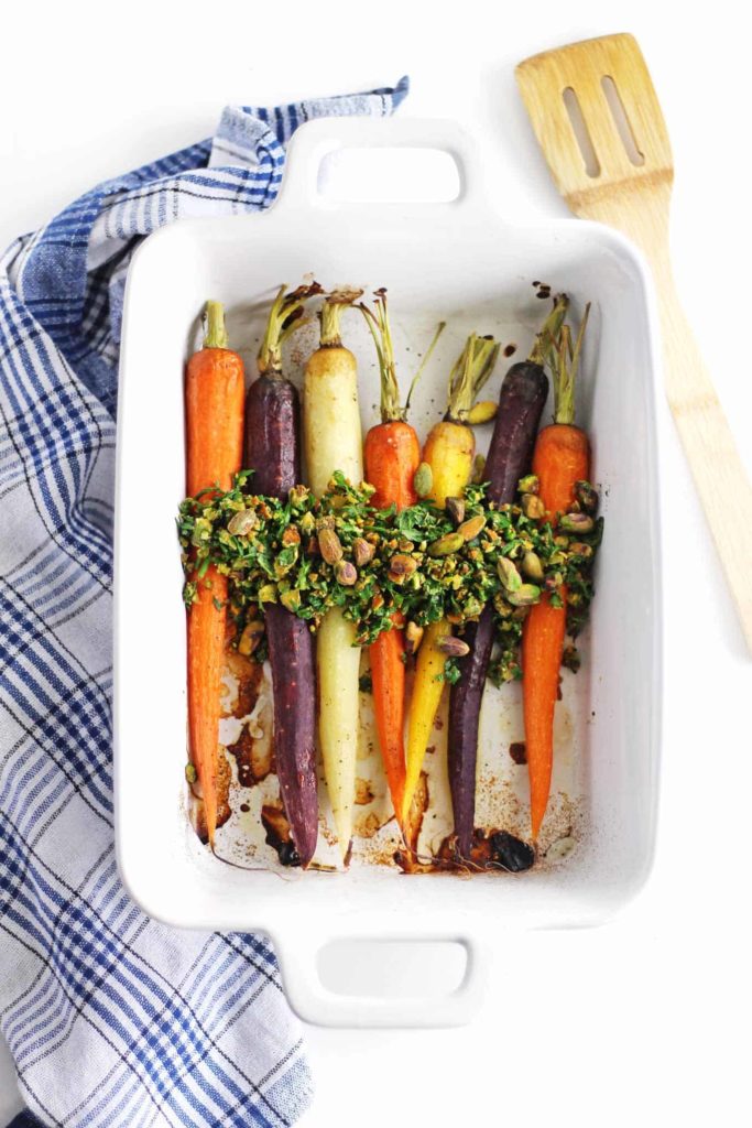 Rainbow carrots with carrot green pistachio topping