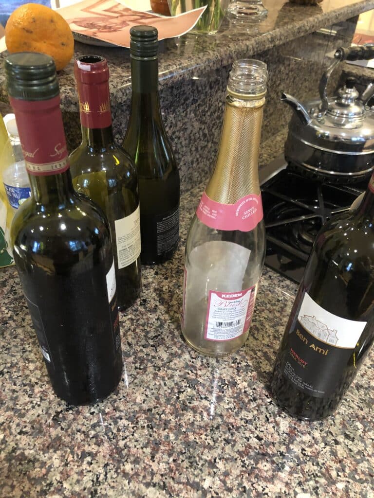 Partially emptied wine bottles at Passover.