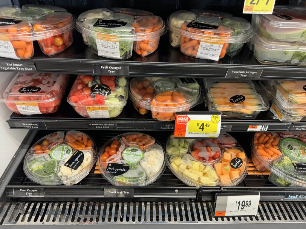 veggie trays on display at store